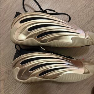 Gold and Black Men’s Athletic Shoes